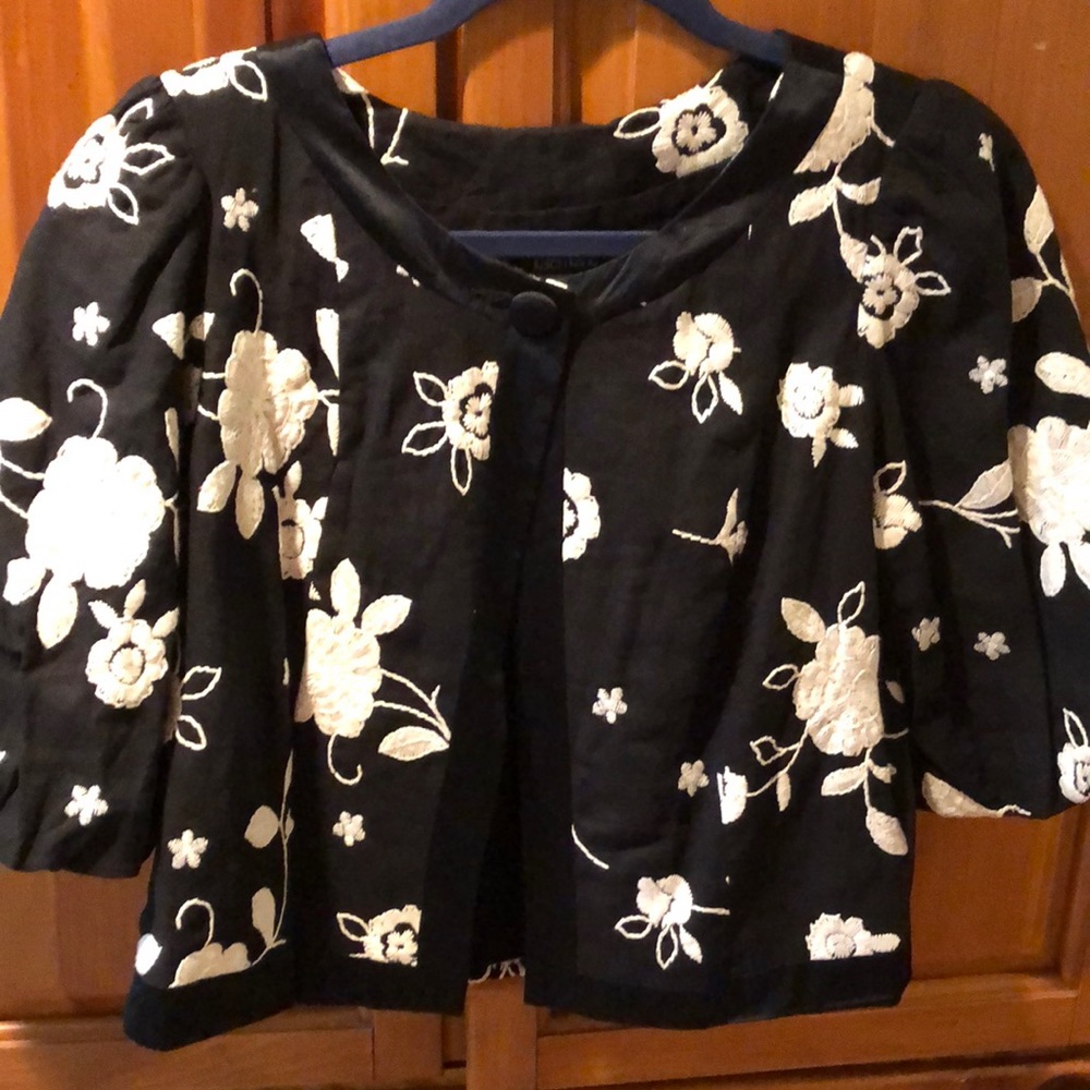 Beautiful cropped embroidered jacket.  Black and cream. Satin covered buttons.